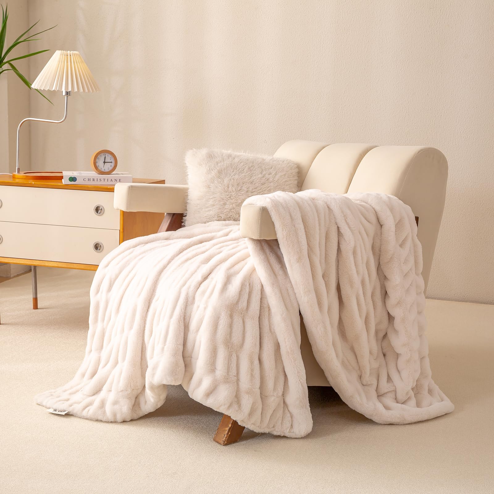 YUSOKI throw draped over bed creates inviting spa-like warmth in a modern bedroom