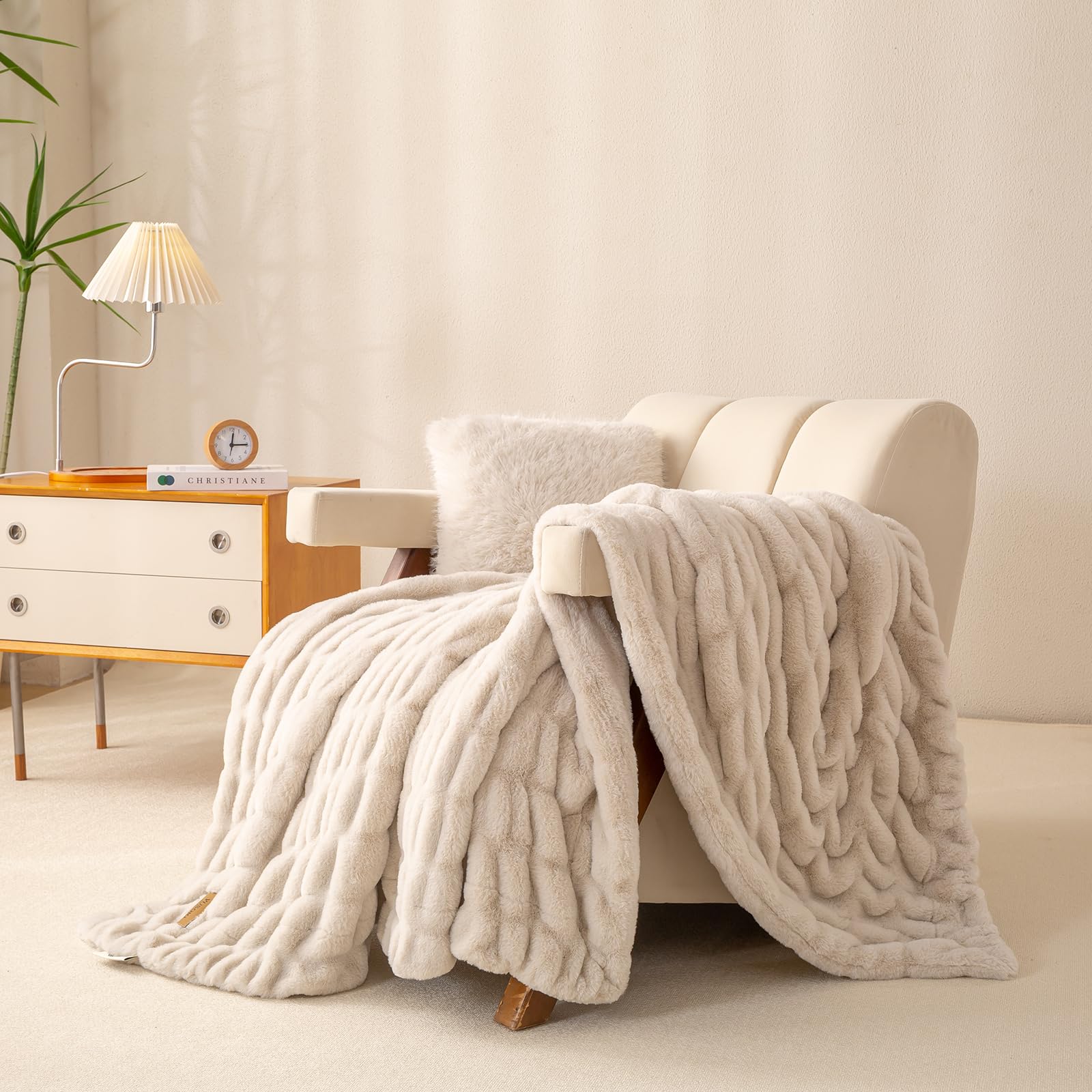YUSOKI double-sided fur throw draped over a chair adds warm ambiance.