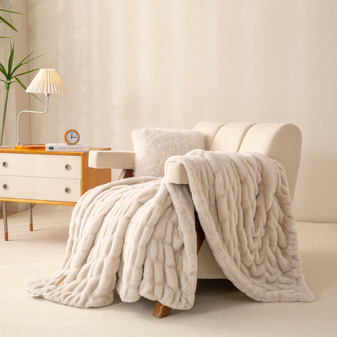 YUSOKI double-sided fur throw draped over a chair adds warm ambiance.