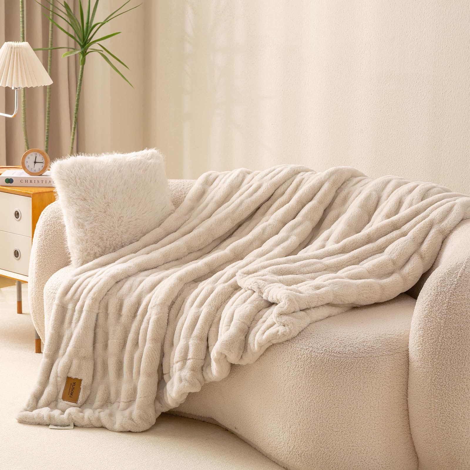 YUSOKI luxury throw with bubble texture closeup enhancing plush comfort on bed.