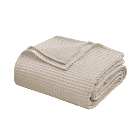 Decor-friendly Zaizaihome waffle throw adds natural khaki texture to a bed.