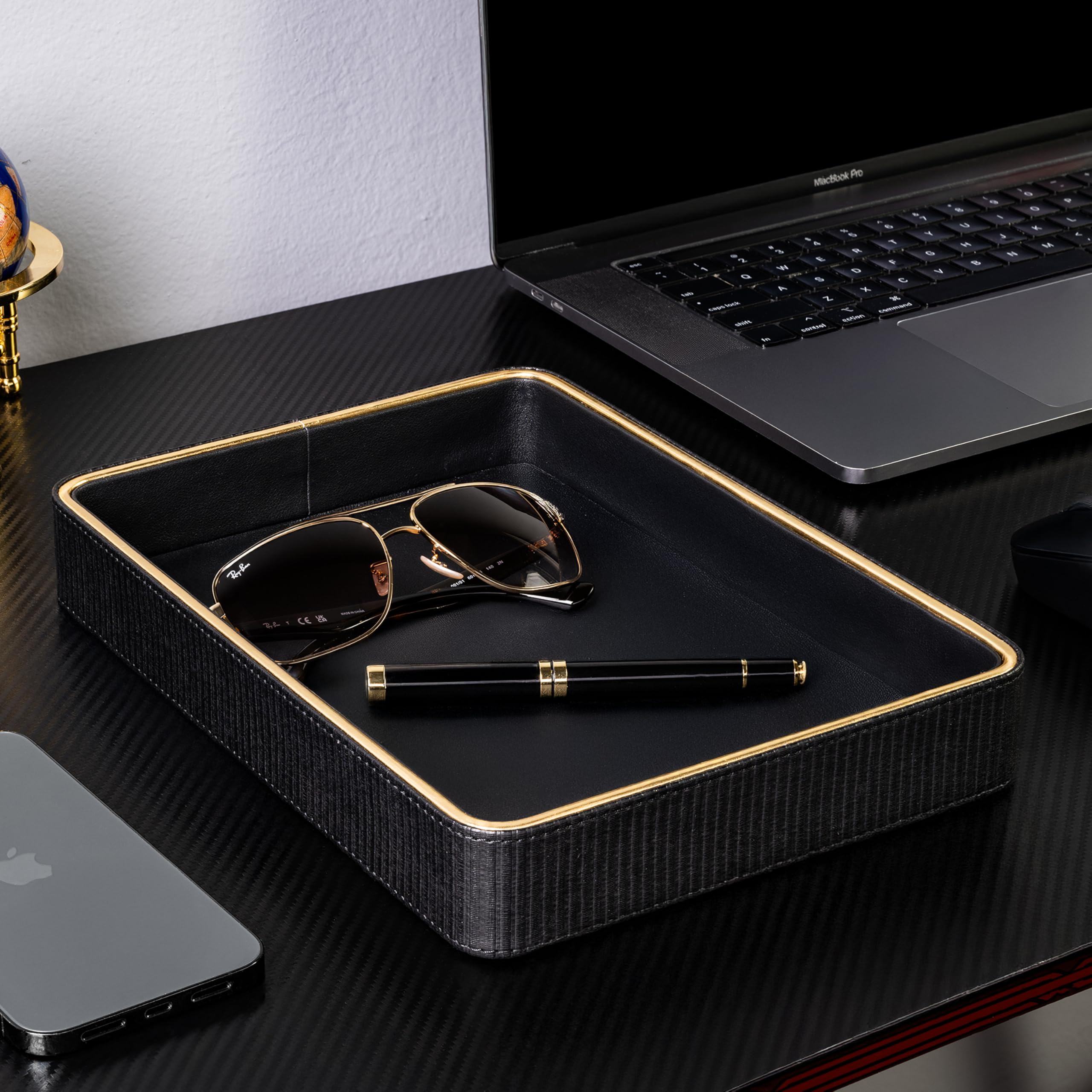 ZHEM leather catchall tray with items like perfume and keys within easy reach.