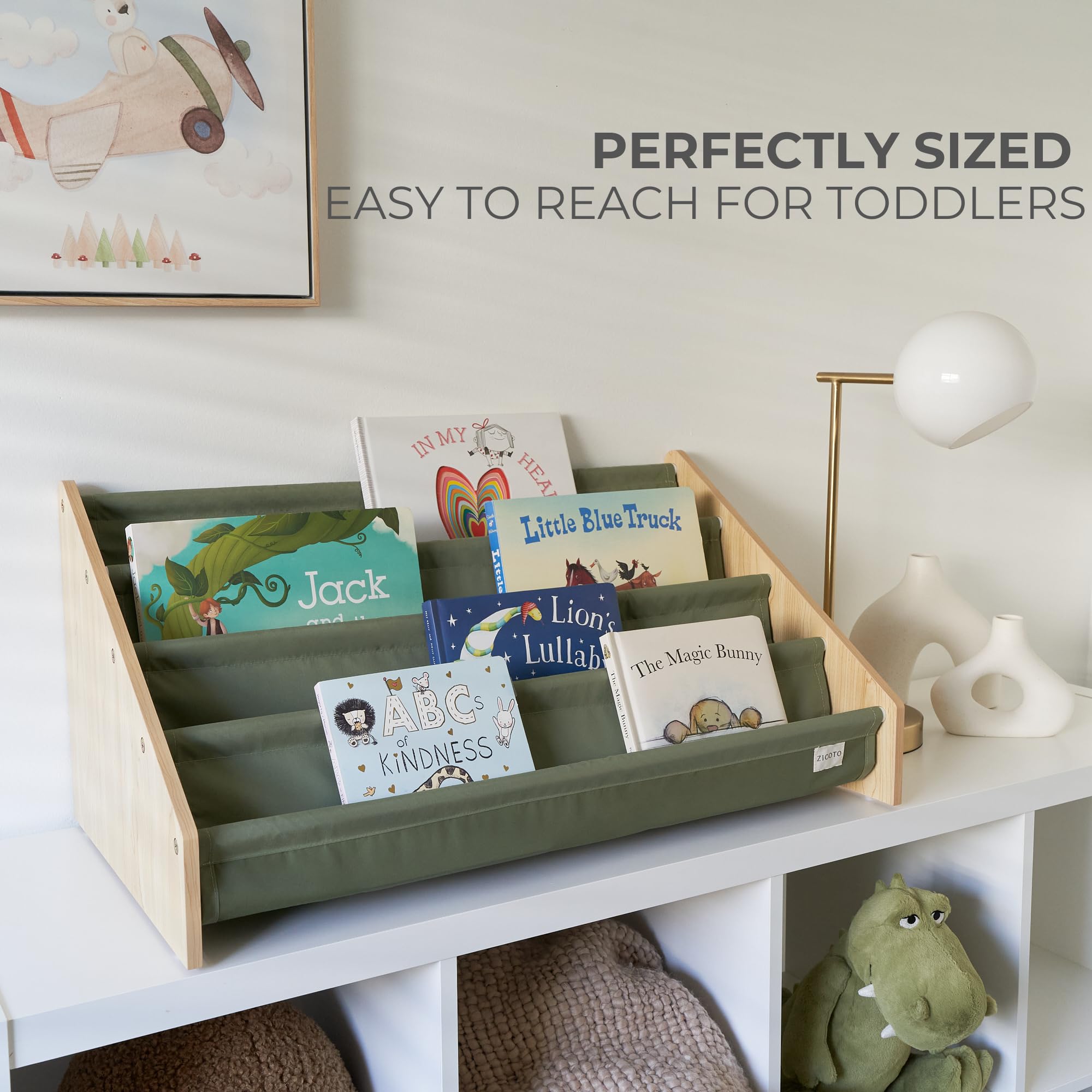 ZICOTO nursery display in soft sage tone creates a cozy reading corner.
