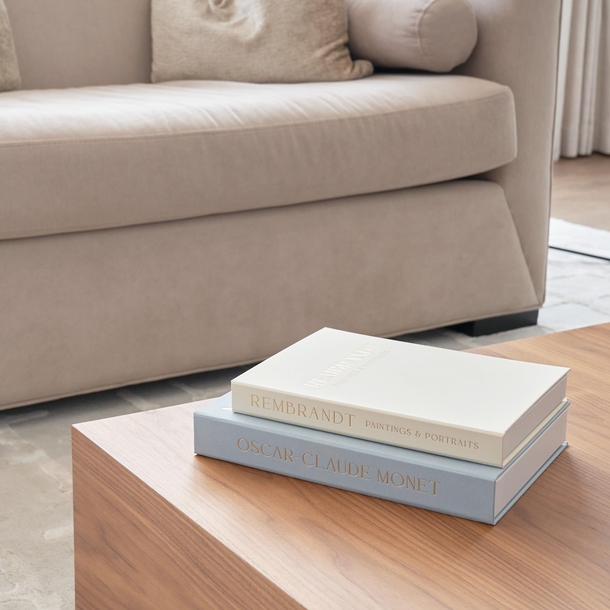 ZICOTO decorative books styled on a coffee table for inviting living room decor.