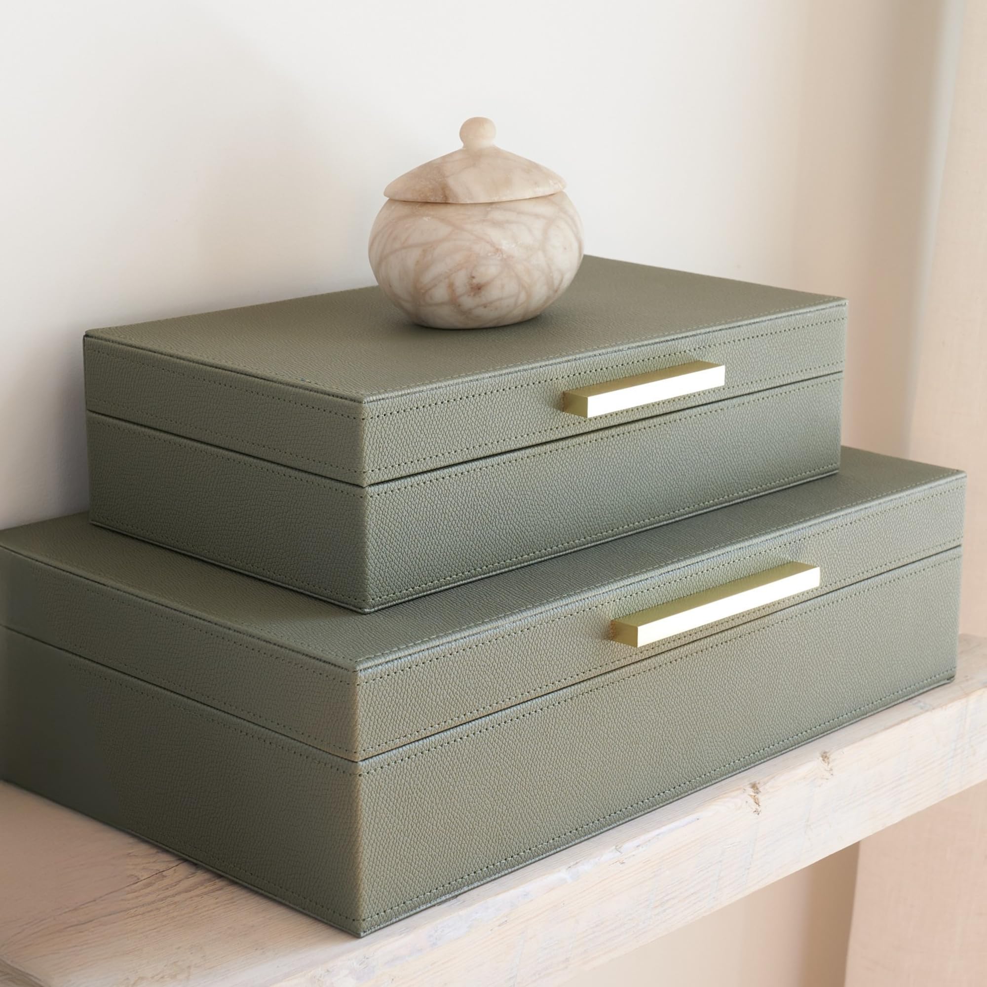 ZICOTO small decorative storage box with lid keeps photos neatly organized.