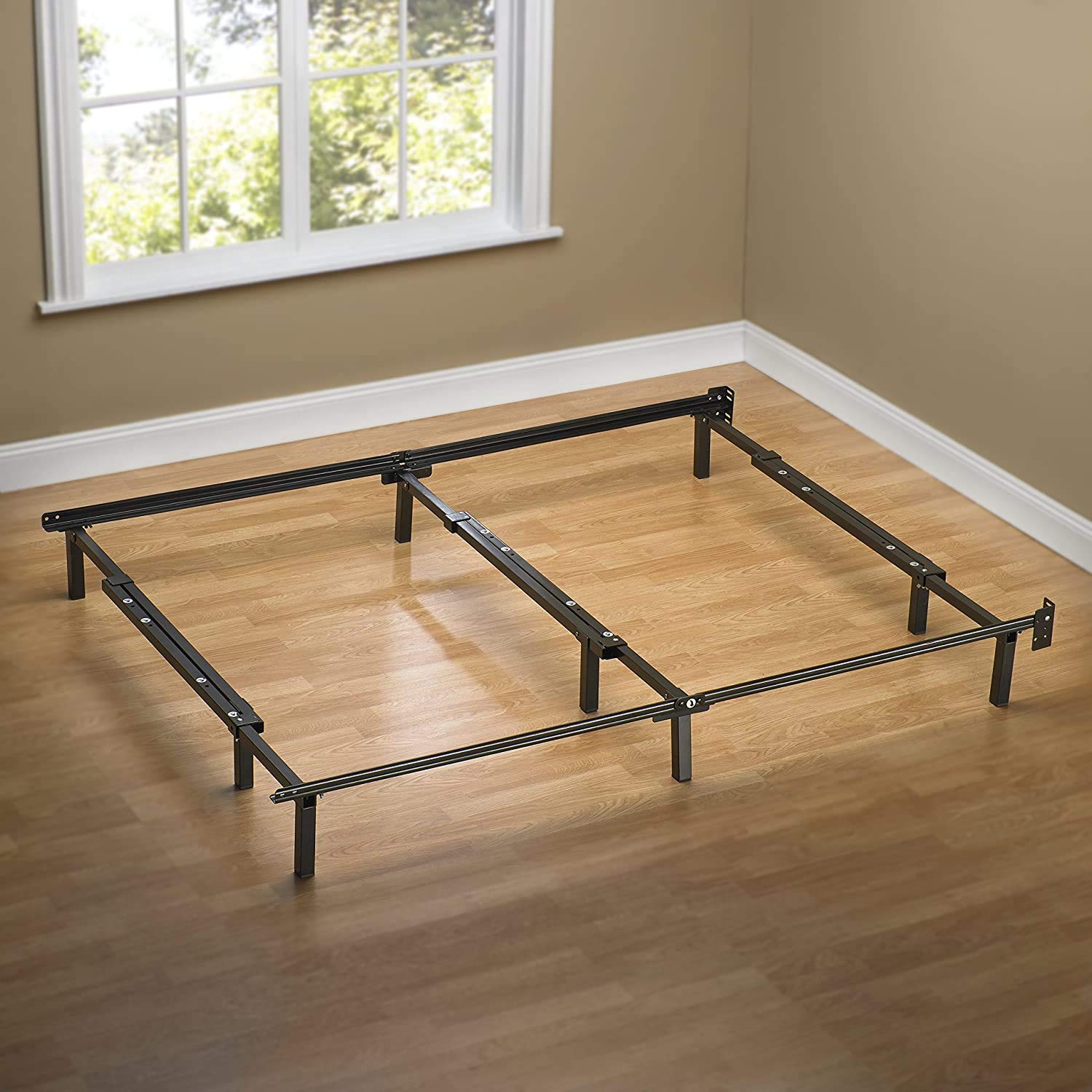 Under-bed storage on Zinus Compack frame demonstrating extra space