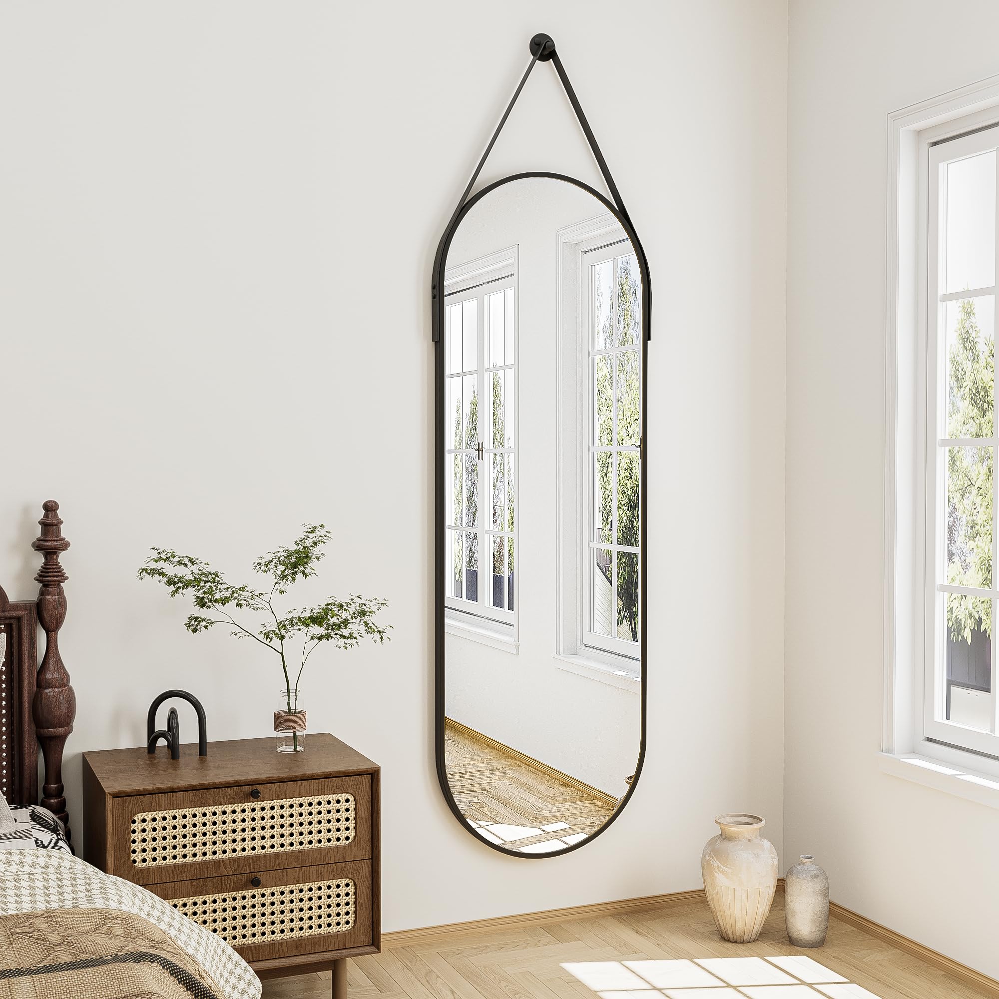 ZMYCZ oval mirror with leather strap hanger for versatile wall mounting.