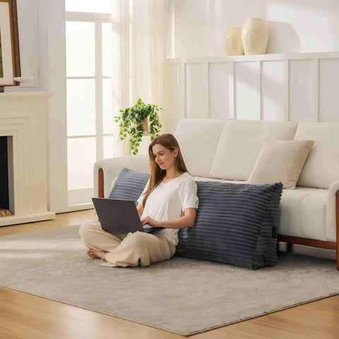 Zonamat headboard pillow in living room supports comfortable reading and light work