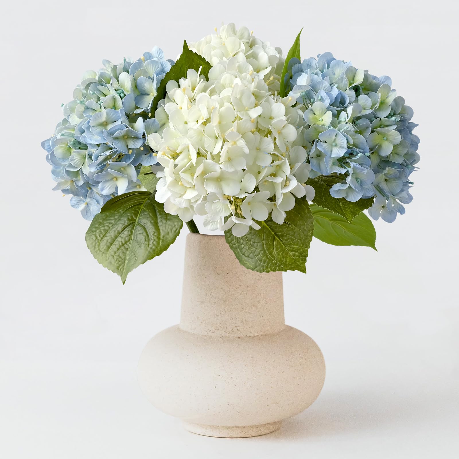 ZYTYUO white hydrangea head close-up showing soft latex petals and realistic details.
